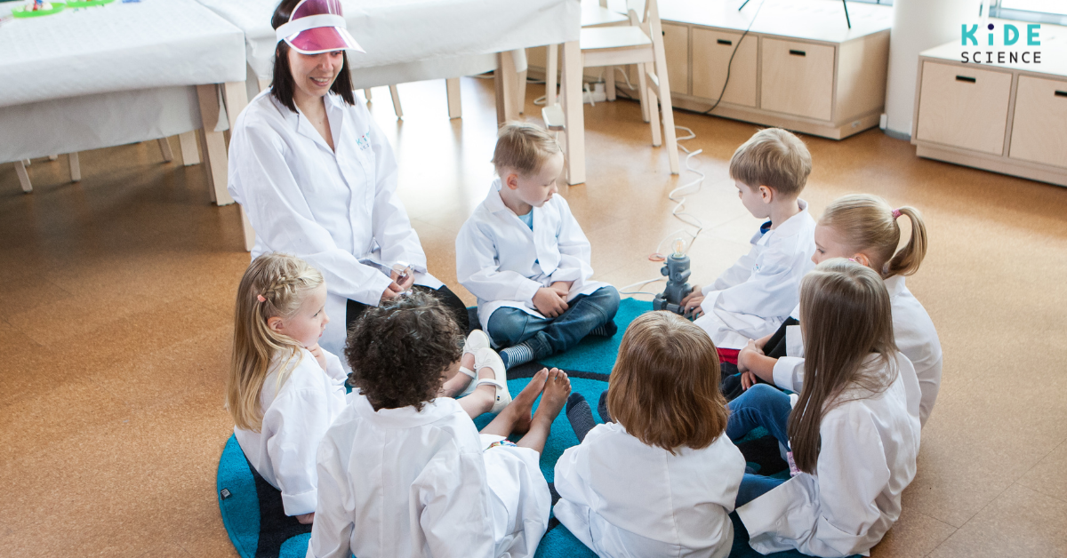 A teacher sitting in a circle with students